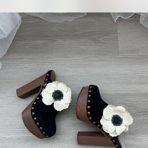 CHANEL Black and Brown Mules with White Floral Accent